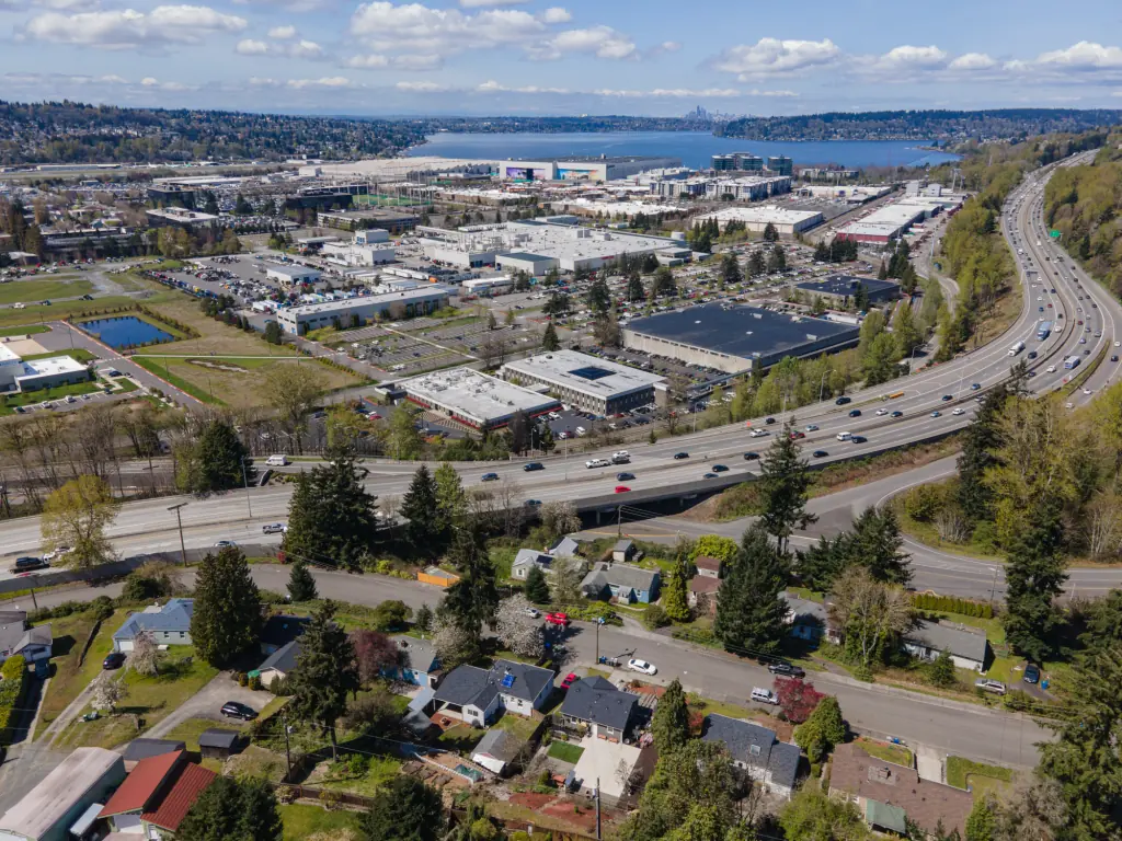 Aerial view of Renton, WA, with a highway and buildings.