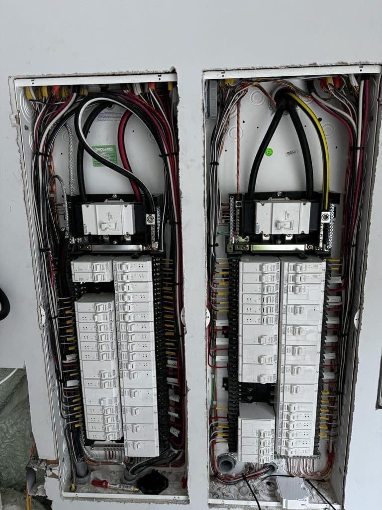 Dual main electrical service panels installation in Ames Lake Washington custom smart home