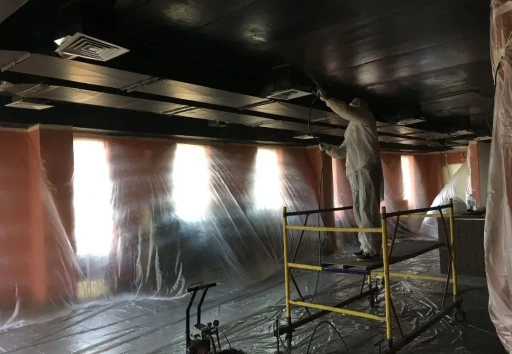 Commercial ceiling painting project using lift equipment in Bellevue Washington