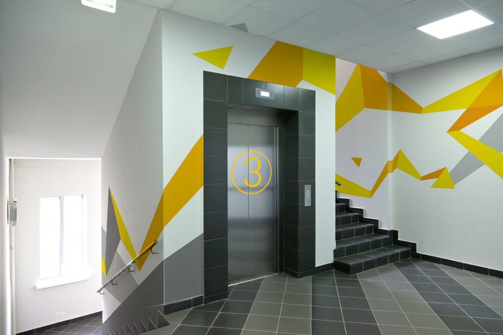 Commercial interior painting with decorative wall design in office building