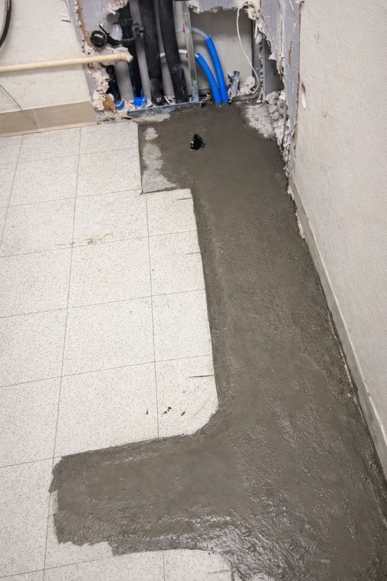 Concrete poured to restore floor after plumbing trench installation in veterinary clinic Bellevue WA