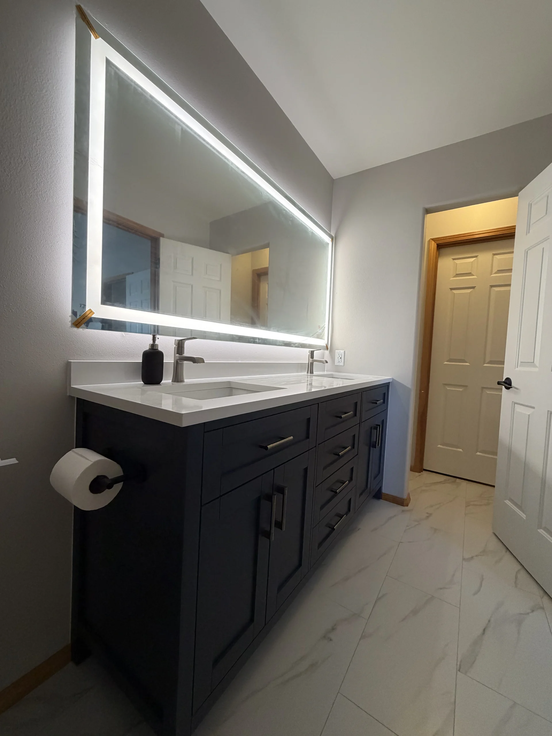 Newly renovated modern bathroom completed as part of Water Damage Restoration in Seattle WA.