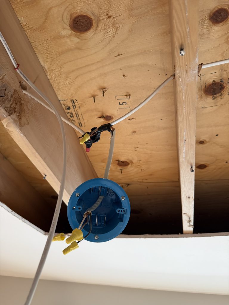 Unsafe wire nut electrical connections found in open ceiling during restoration