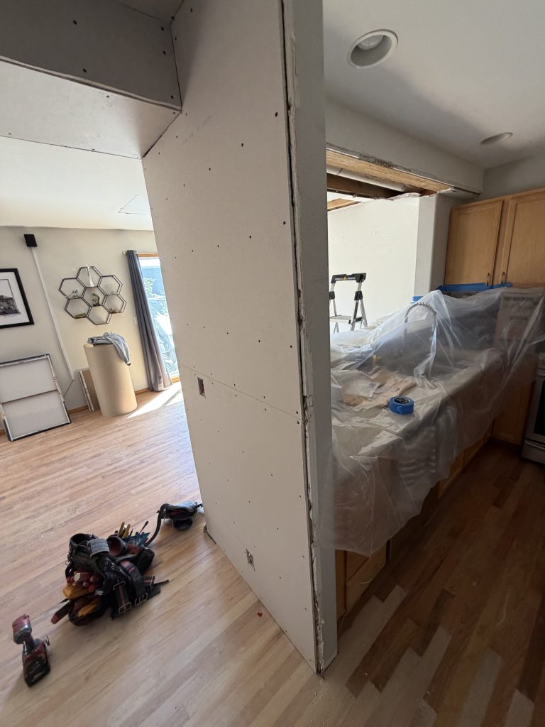 Hallway with newly installed drywall after water damage restoration
