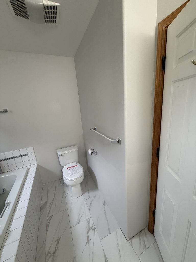 Finished bathroom with new floor and wall tile