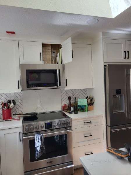 Bothell kitchen before water damage cleanup, cabinets still in place