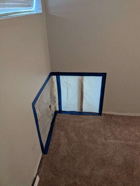 Containment plastic sealing off a basement work area — water damage restoration in Brier, WA by YSG Construct