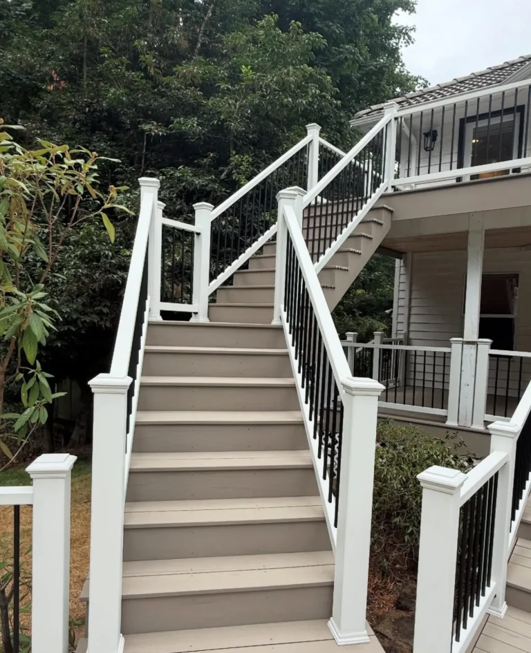 Deck staircase with white railings and black balusters, YSG Construct deck construction