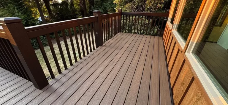Brown composite deck with dark railing built by YSG Construct