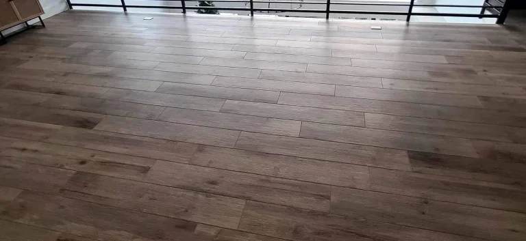 New wood-look flooring installed across a large living space by YSG Construct