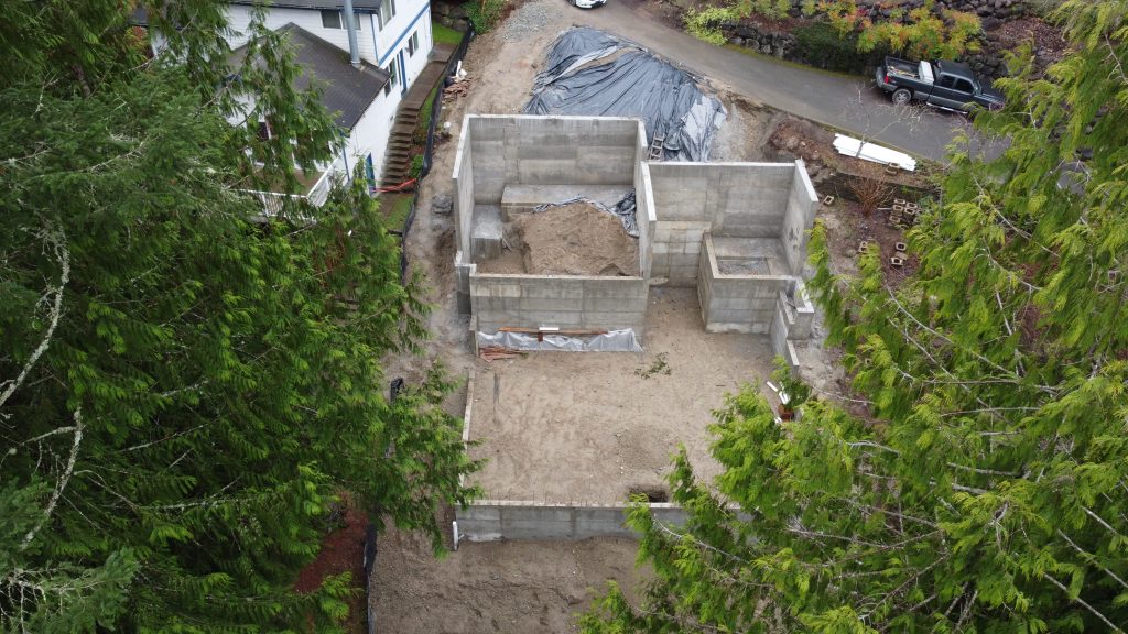 Aerial view of poured concrete foundation walls — new construction foundation by YSG Construct near Redmond WA