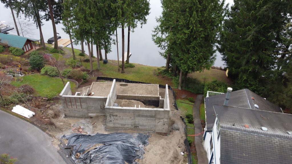 Drone photo of foundation construction above Ames Lake — YSG Construct, Eastside WA