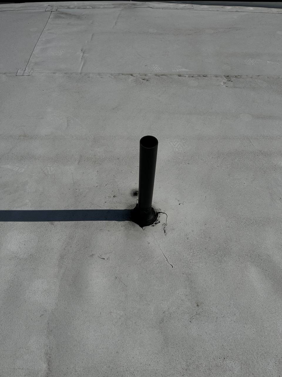 Finished sealed black roof vent on commercial flat roof in Lacey WA