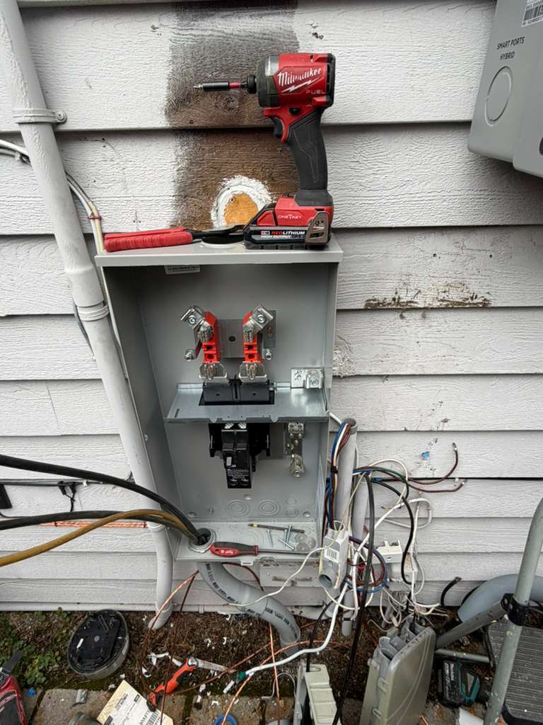 Old meter base opened up during a meter replacement in Redmond, WA