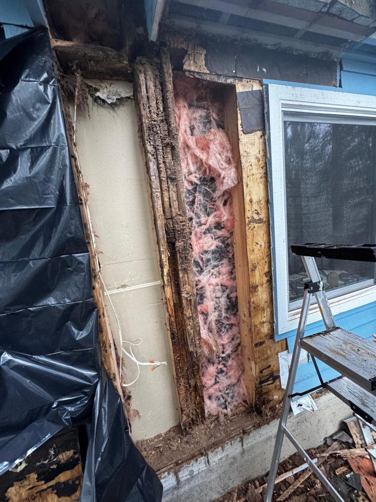 Rotted wall framing exposed during structural wall rebuild in Redmond WA by YSG Construct