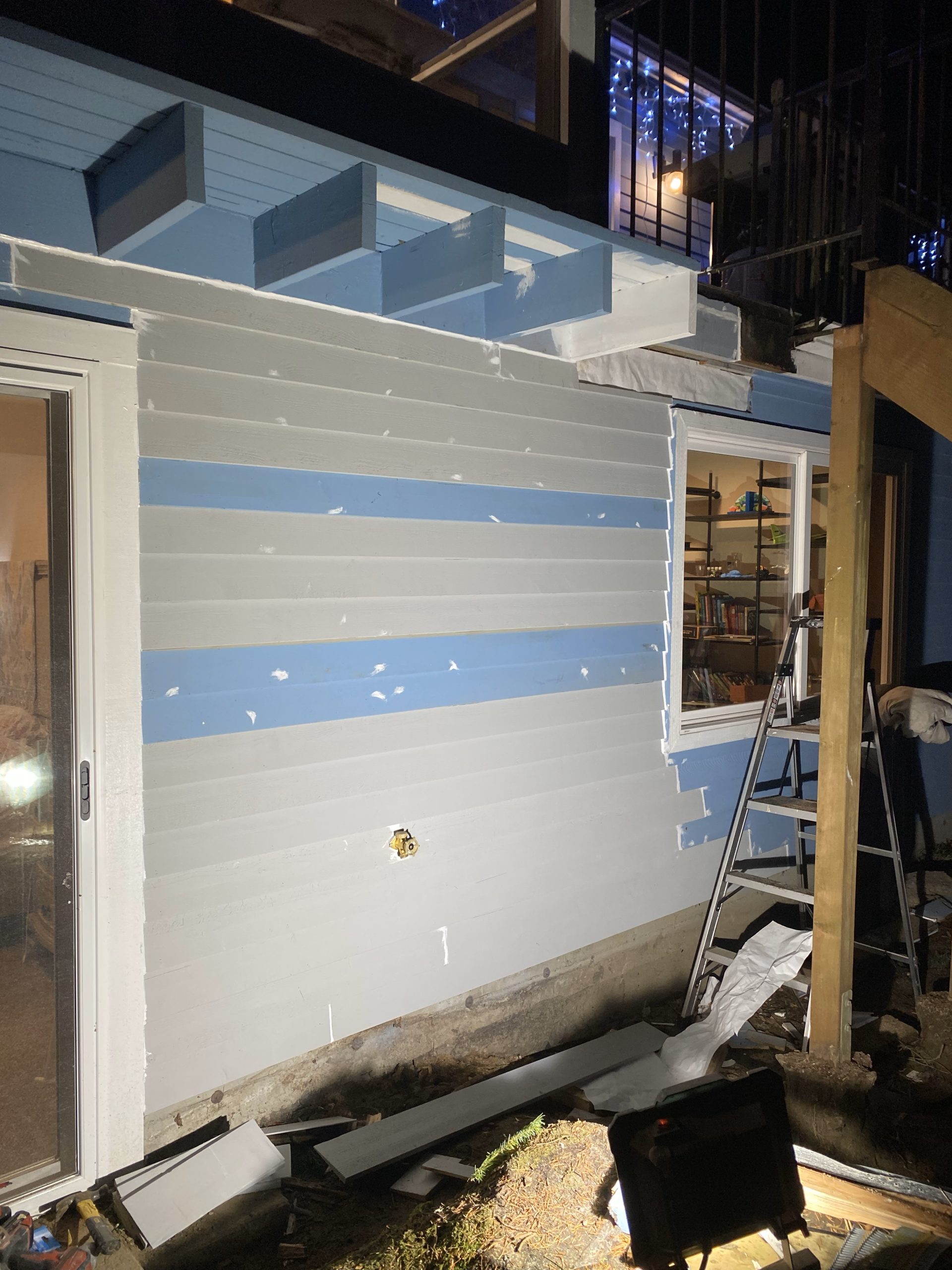 Installing new exterior siding during structural wall repair in Redmond WA
