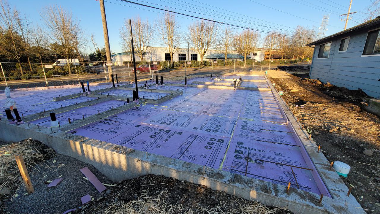Rigid foam board insulation laid over the whole new foundation slab area in Tacoma WA by YSG Construct