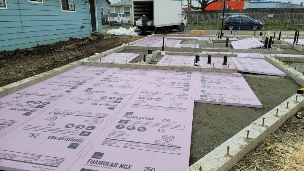 Foam slab insulation boards with sealed pipe penetration in Tacoma WA by YSG Construct