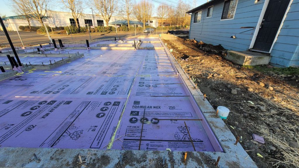 Plumbing stubbed up through foam slab insulation in Tacoma WA by YSG Construct