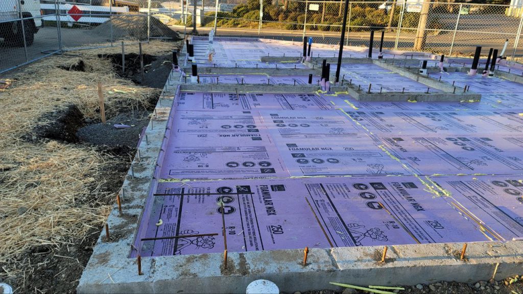 Marked foam insulation boards ready for concrete slab pour in Tacoma WA by YSG Construct
