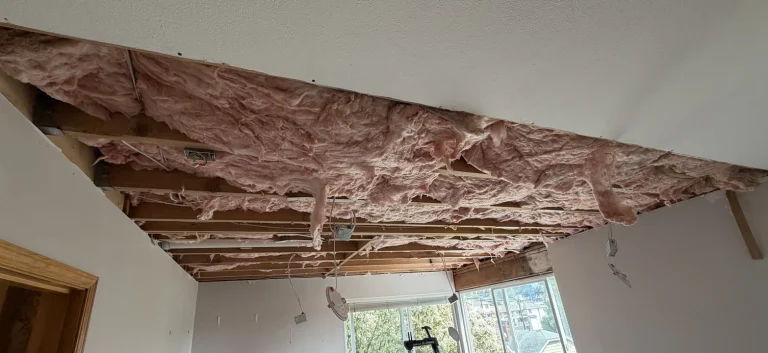 Water damage restoration — opened ceiling and insulation during dry-out by YSG Construct