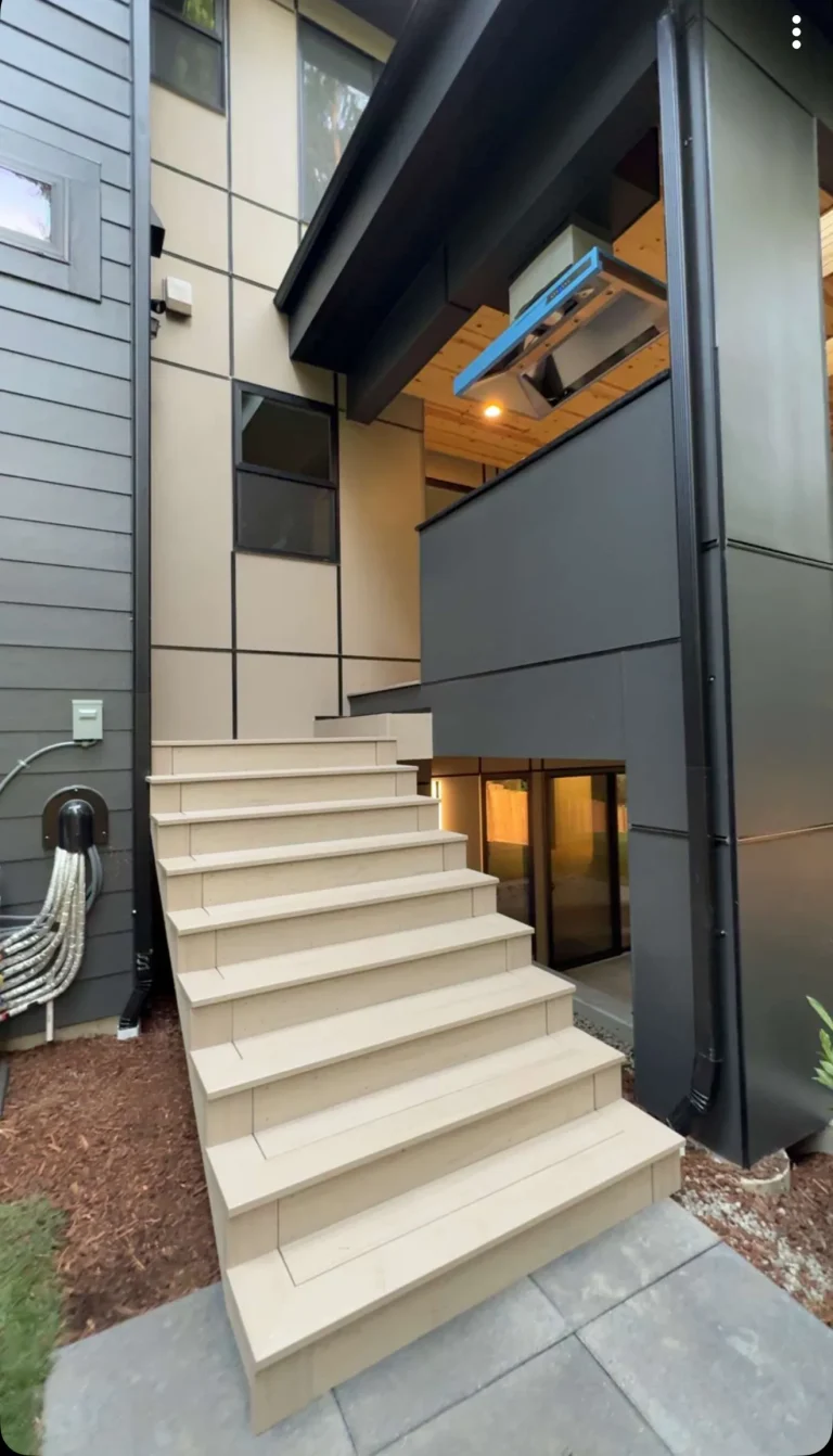 Wide front entry stairs at a modern home, built by YSG Construct in the Bellevue area